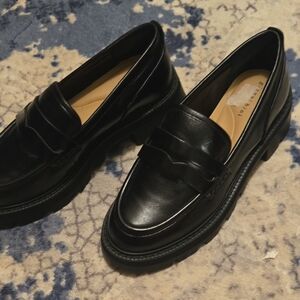 Glossy Black Leather Slip-On Loafers with Moccasin Construction